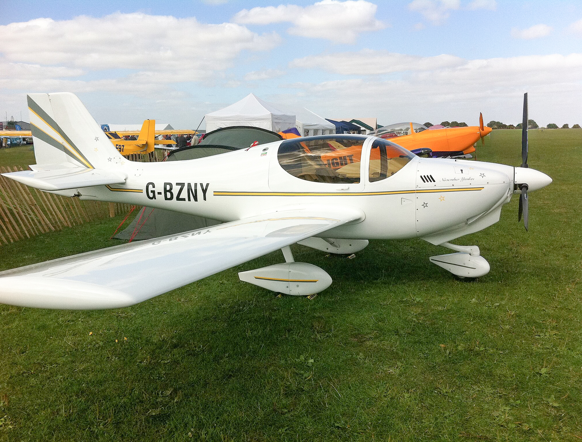 Europa XS aircraft G-BZNY on display at an outdoor airfield.
