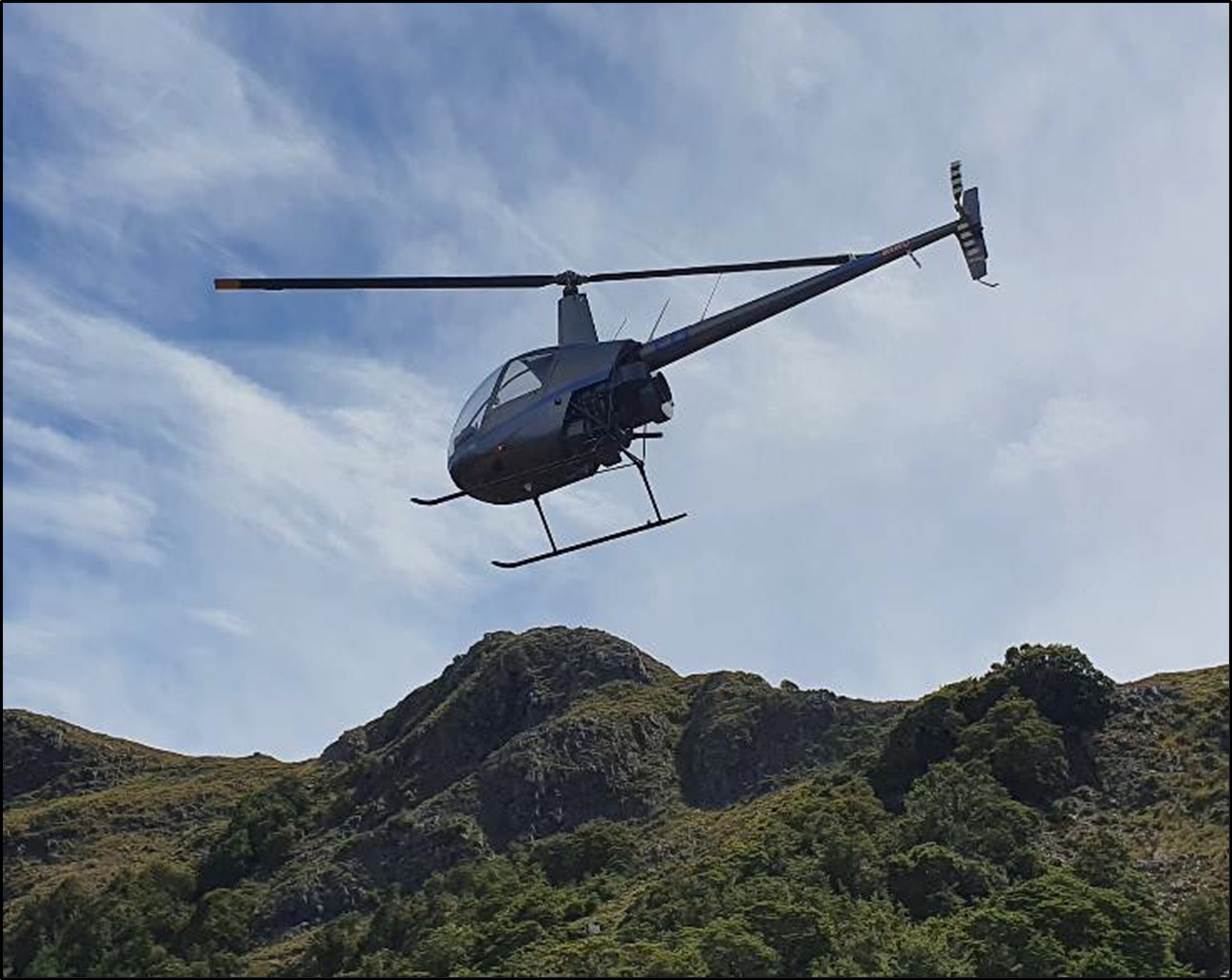 Photo of the helicopter, Robinson R22 Beta II, ZK-HEQ in flight
