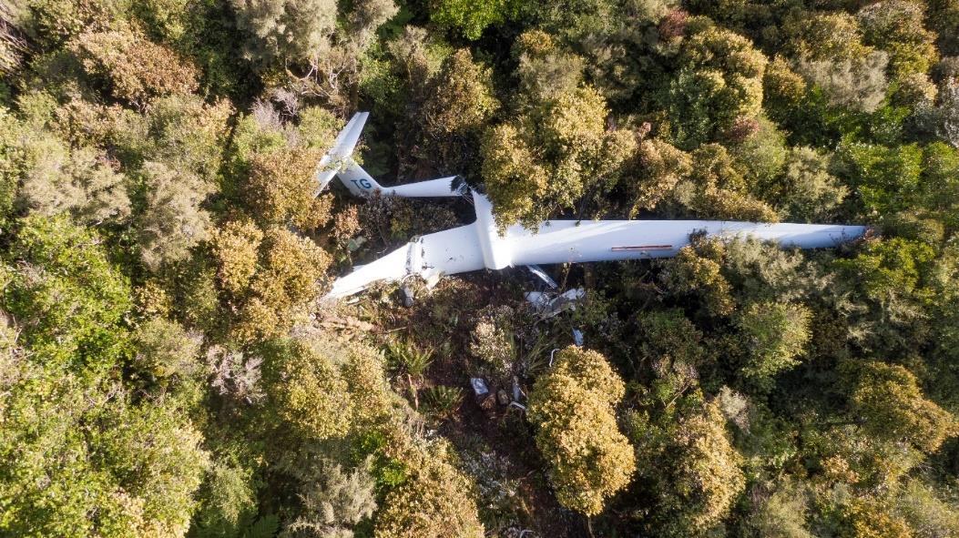 Wreckage and impact path indicated by red arrow with the top of photo is north