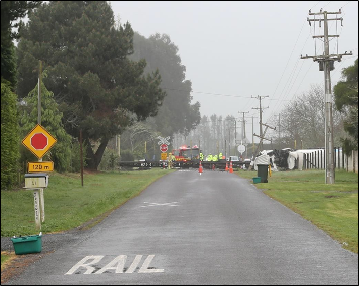 The warning sign and road markings for the northbound approach to the Lambert Road level crossing