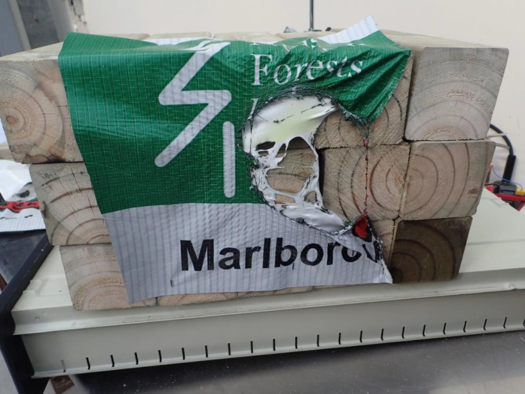 Plastic wrapping after two minutes, 20 seconds of exposure to the ship’s lamp