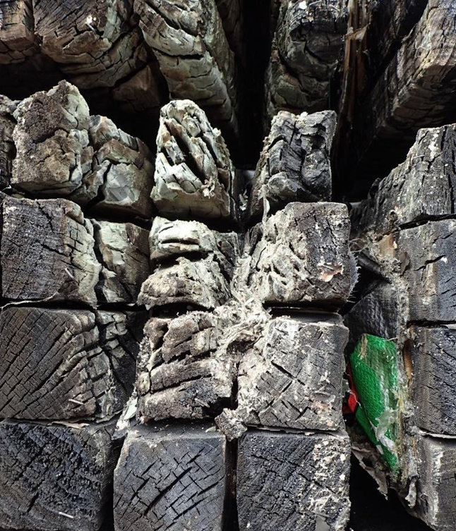 Charred timber at origin of fire