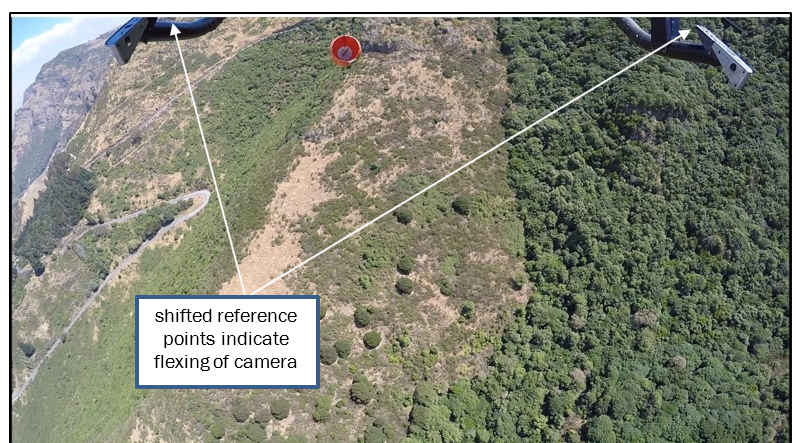 Video capture showing the camera mount flexing rearward, when the bucket was rapidly ascending immediately before it made contact with the tail rotor