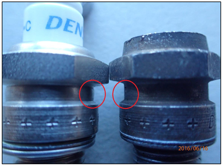 Difference in length compared with a new plug (on left), and comparison of ‘bulge’ (circled)