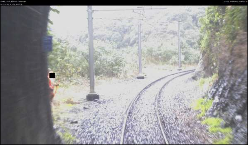 CCTV showing track workers coming into view as train exits tunnel 5