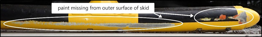 Outer left rear skid, showing two layers of paint missing