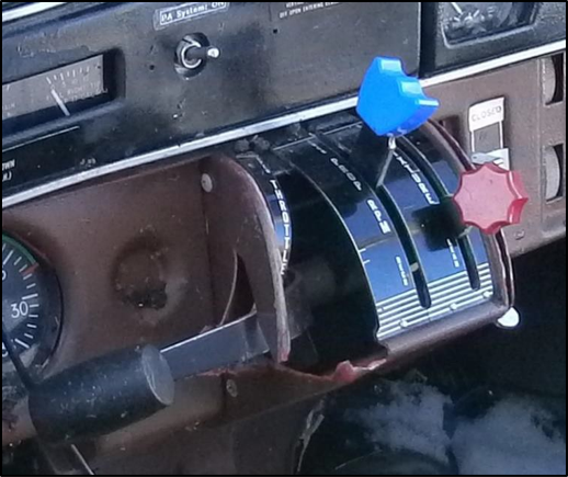 Figure 5 Cockpit engine controls (throttle, propeller pitch, fuel mixture)
