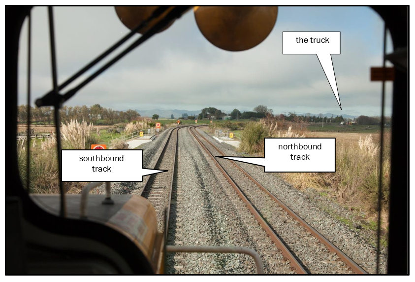 The train driver’s first sighting of the truck approaching the Te Onetea Road level crossing (photograph taken by New Zealand Police at incident reconstruction held on 10 May 2014)