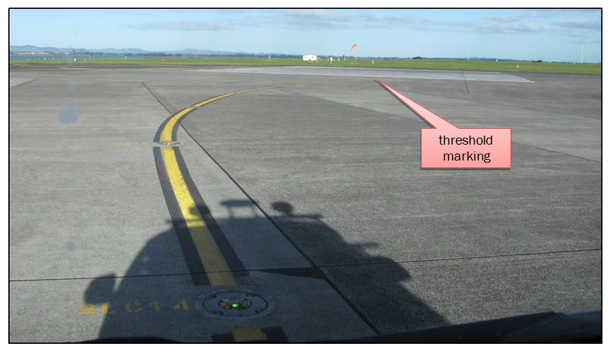 Figure 7 Daylight view of taxiway A1 centreline lights and paint markings leading to runway 23 Left (taken from 1.5 m above surface)