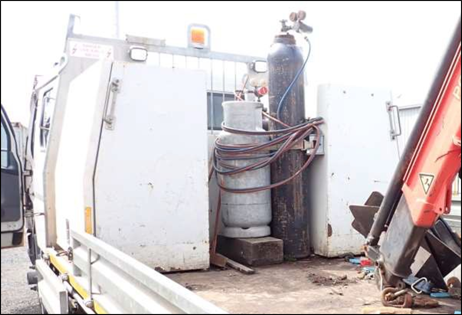 Gas bottles secured to metal cabinets on deck of HRV1