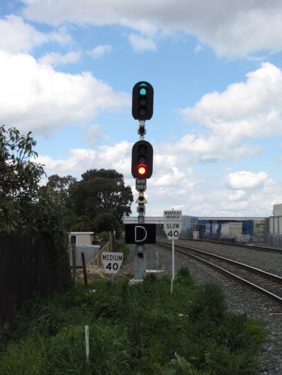 Signal 1803 displaying 'proceed at normal speed' (green over red). Credit TAIC.