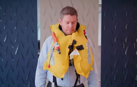 Still from lifejacket demonstration video - TAIC Marine Investigations Manager Jeremy Dann
