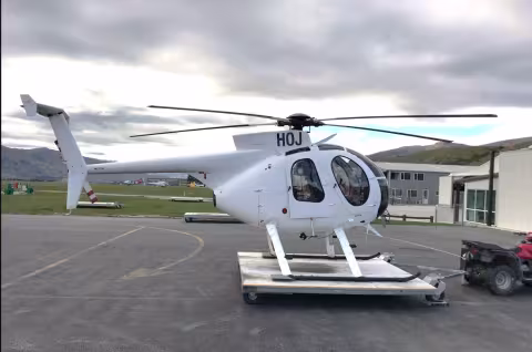 Side view of the MD500 helicopter stationary on the ground